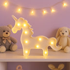 Unicorn LED decorative night light illuminated softly against dark background
