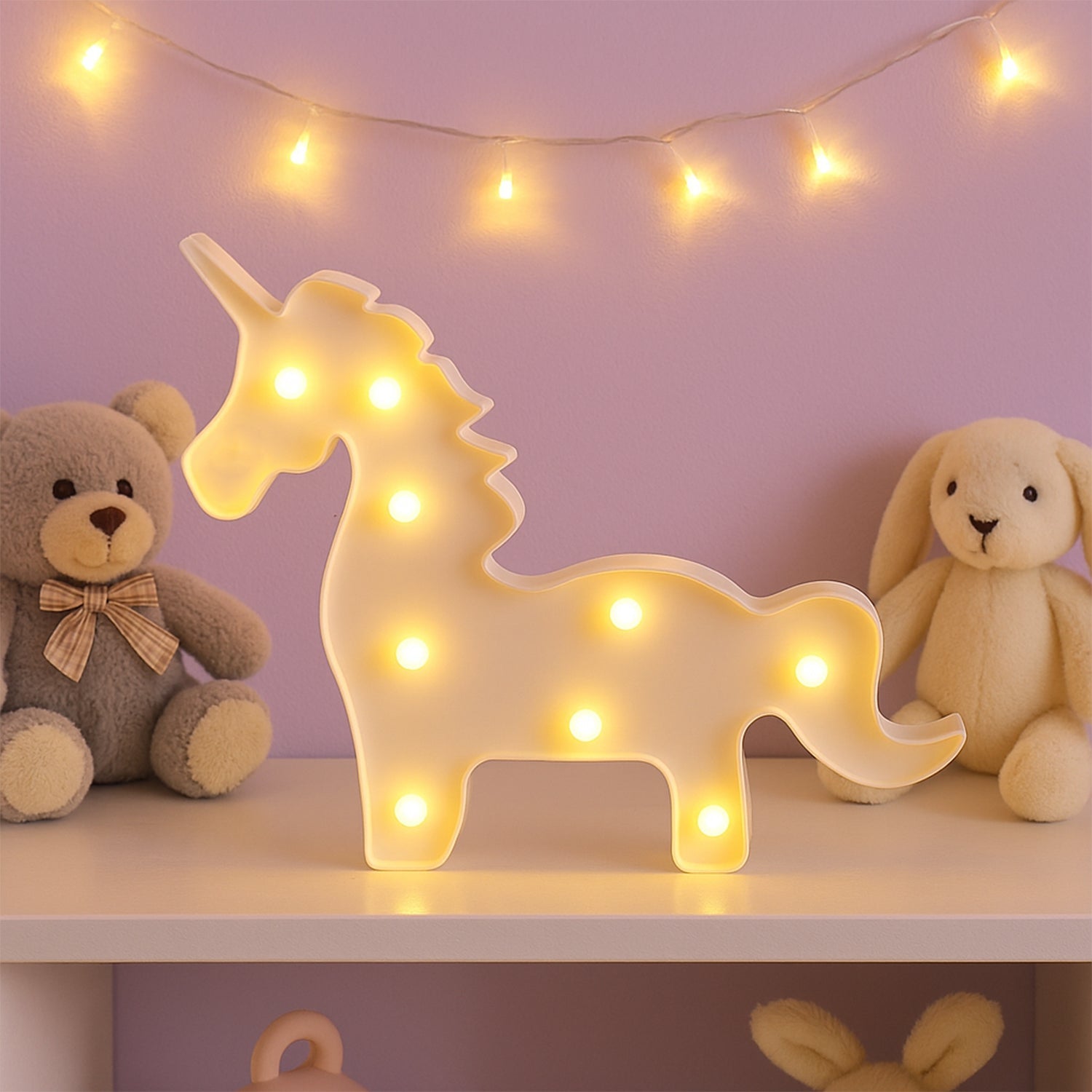 Unicorn LED decorative night light illuminated softly against dark background