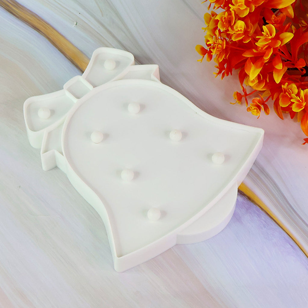 LED Bell Shaped Night Light illuminating with warm light indoors
