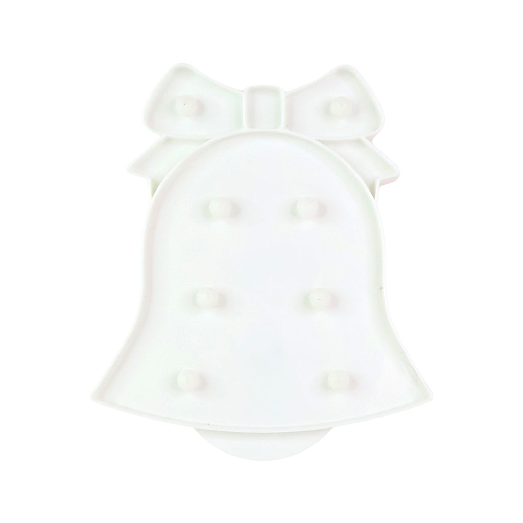 Battery operated LED Bell Shaped Night Light placed on bedside table
