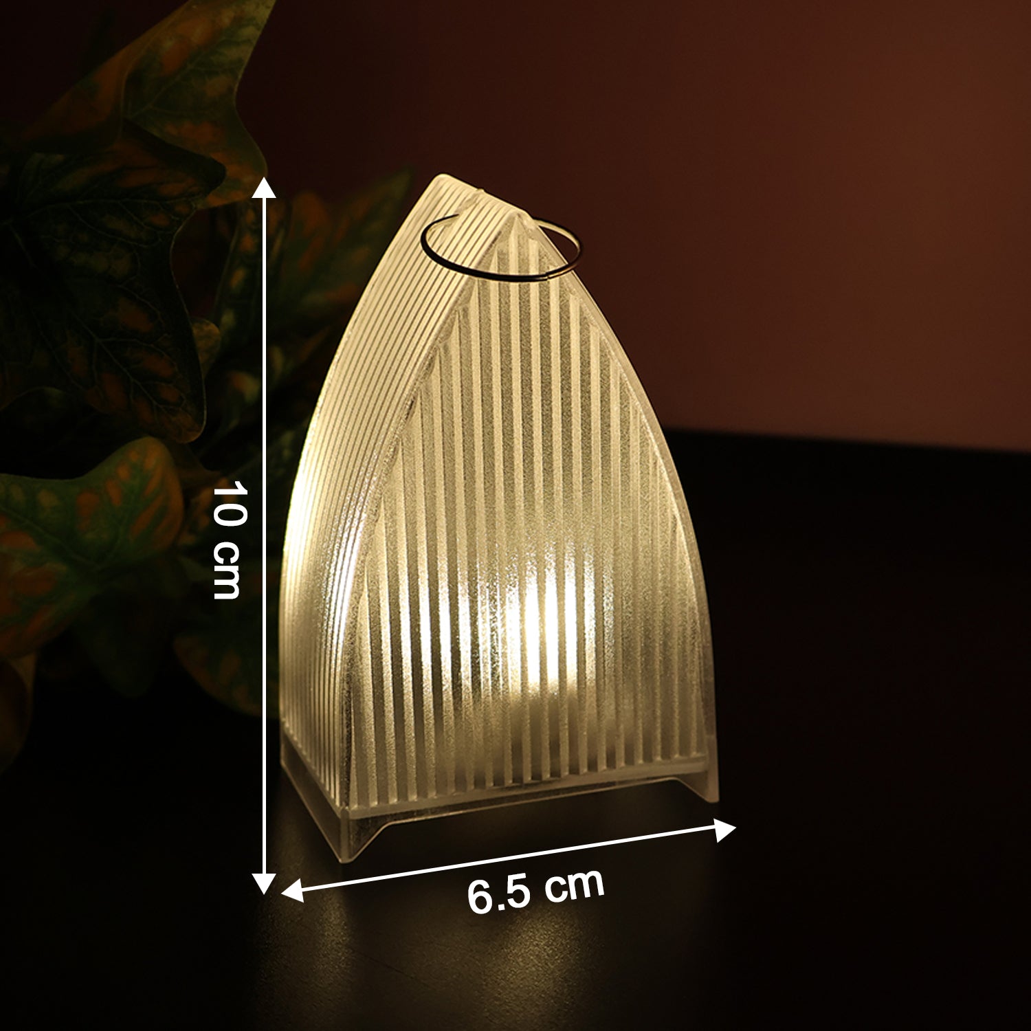 Close up of warm glowing transparent LED decorative candle light