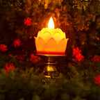 Close-up of lotus shaped LED candle with flickering effect on ornate holder