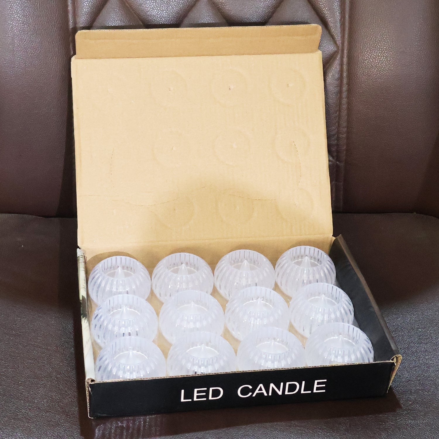 Decorative LED candles with crystal-effect ribbed style glowing warmly indoors