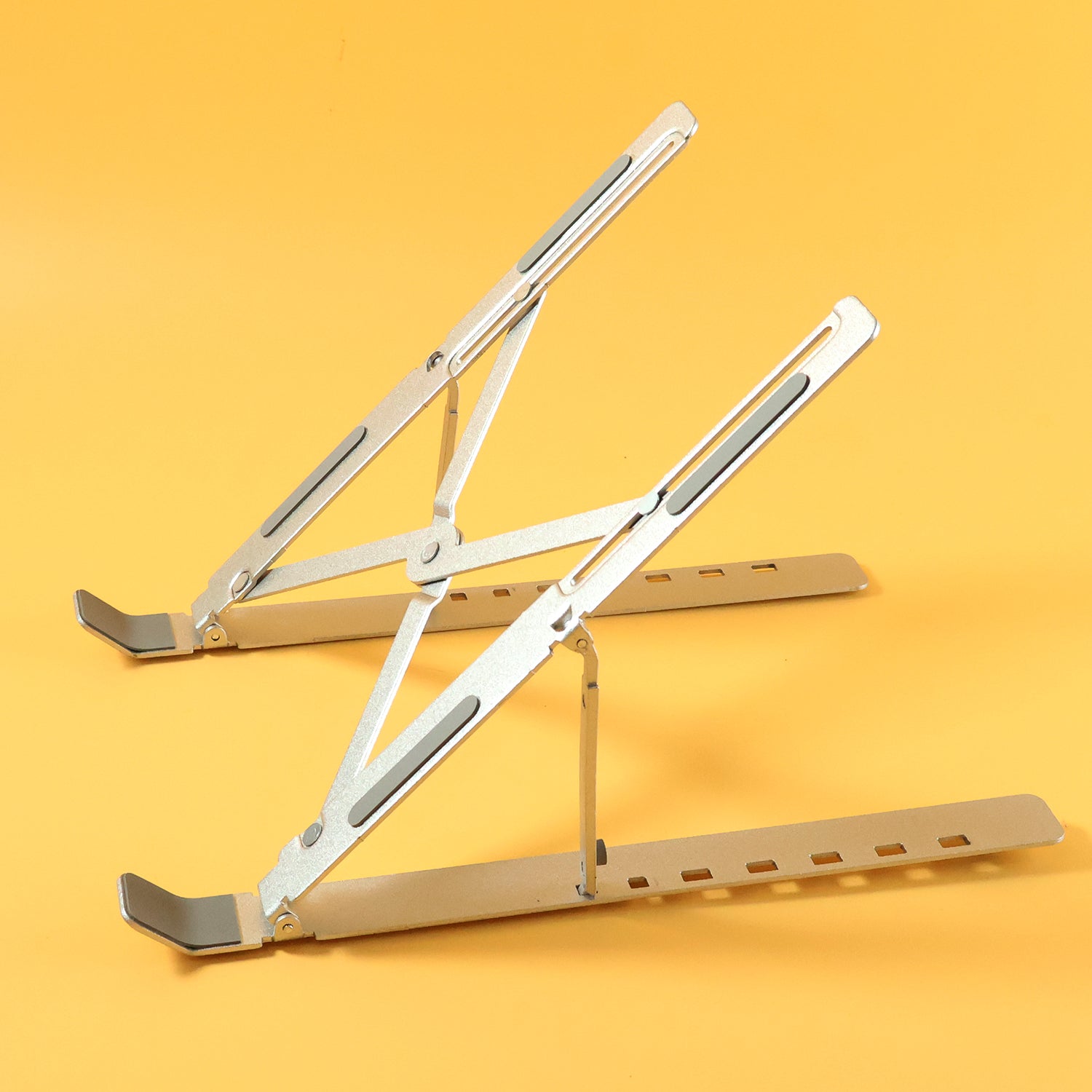 Side view of aluminium adjustable laptop stand folded