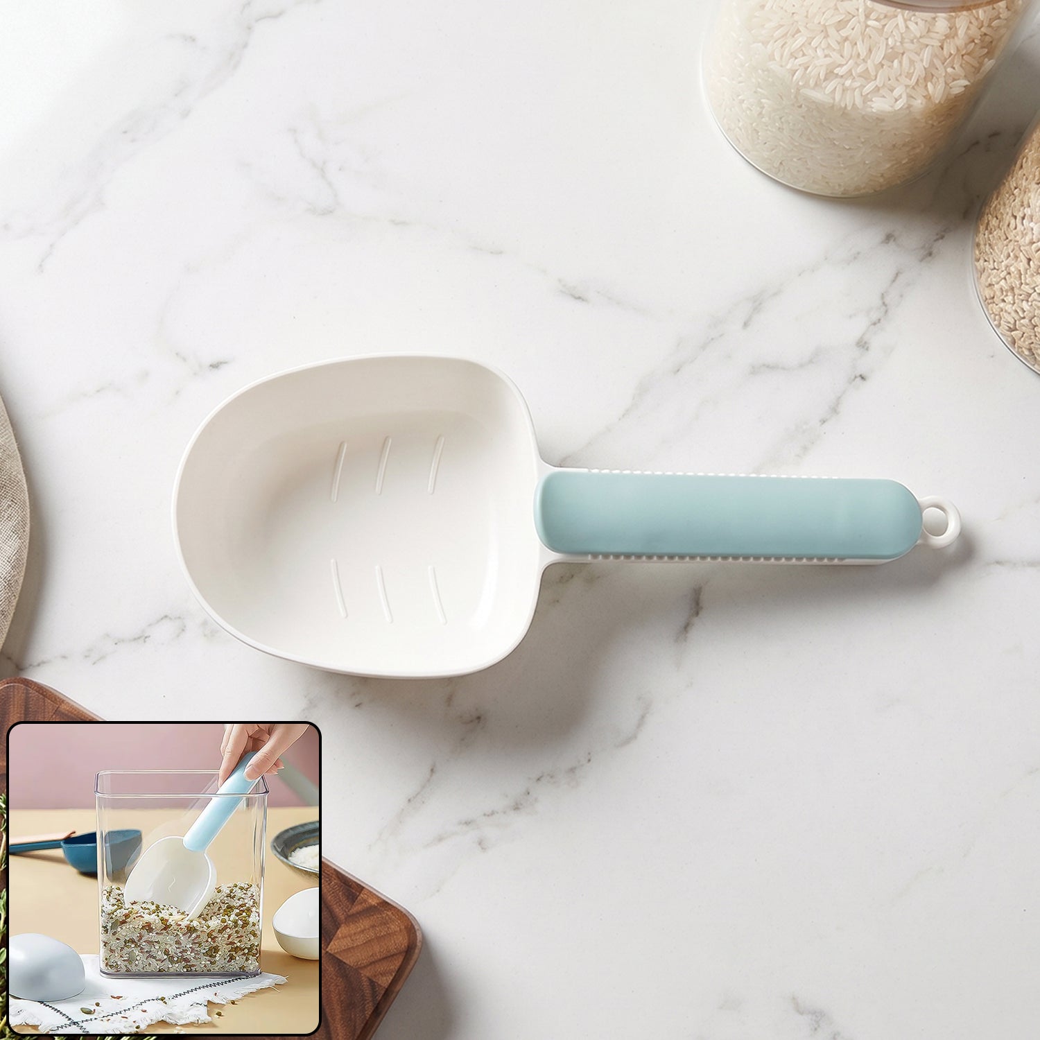 Image of a white plastic measuring spoon with a bag clip feature.