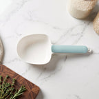 The large capacity plastic scoop ready for measuring rice or grains.