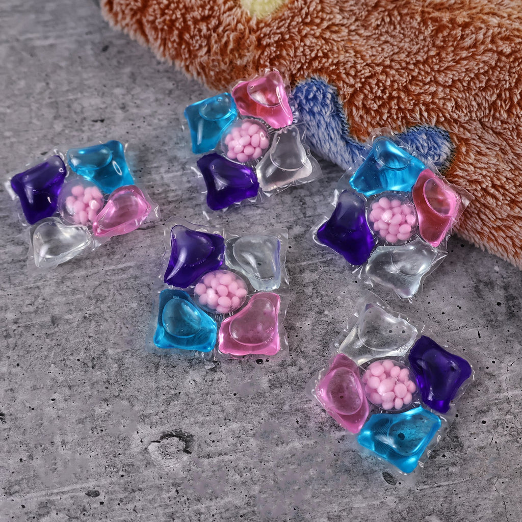 Multi-action detergent pods for household laundry cleaning