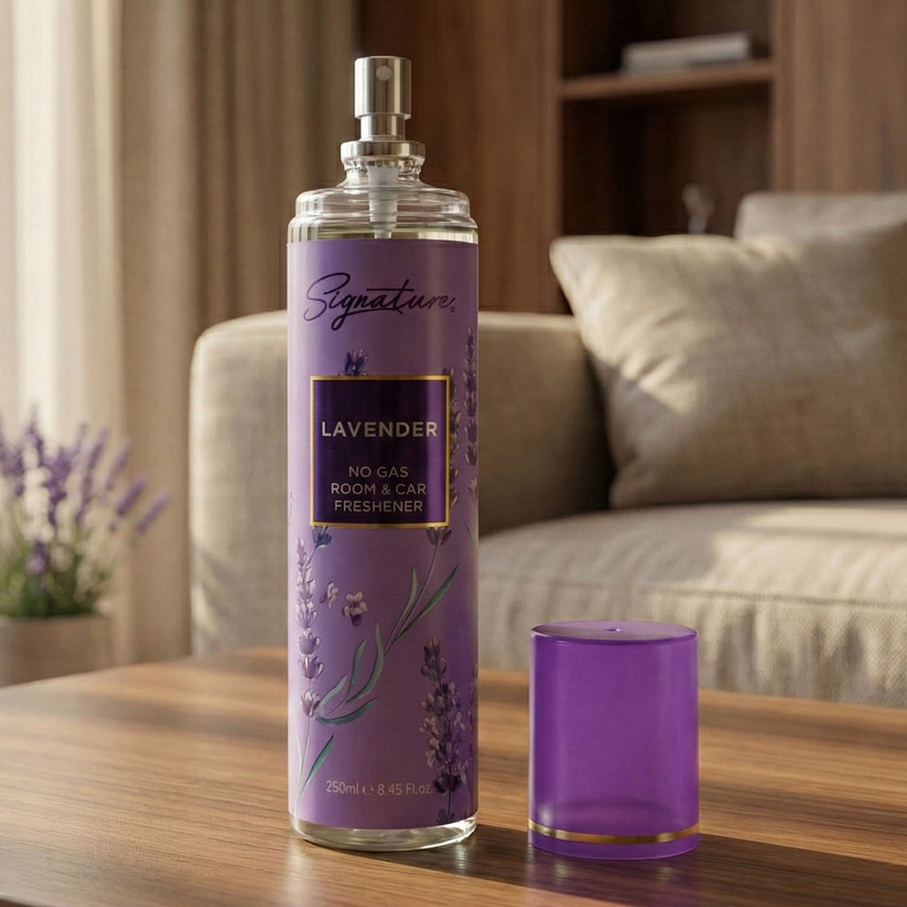 Room and car freshener spray bottle releasing fine mist of lavender fragrance