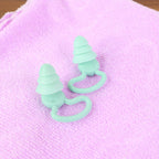Layered silicone earplugs packaged with portable carrying case.