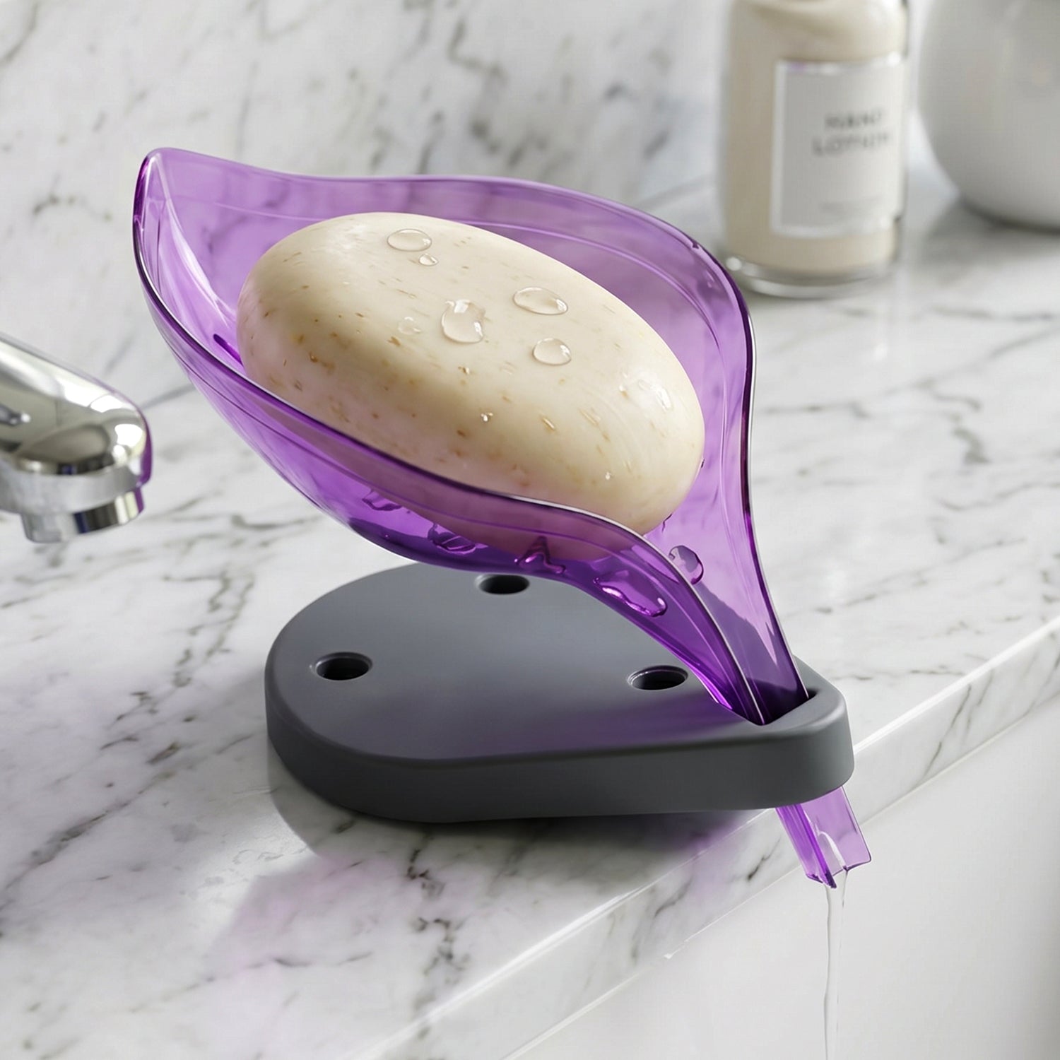 Angled view of a green leaf shape soap tray showing water drainage.