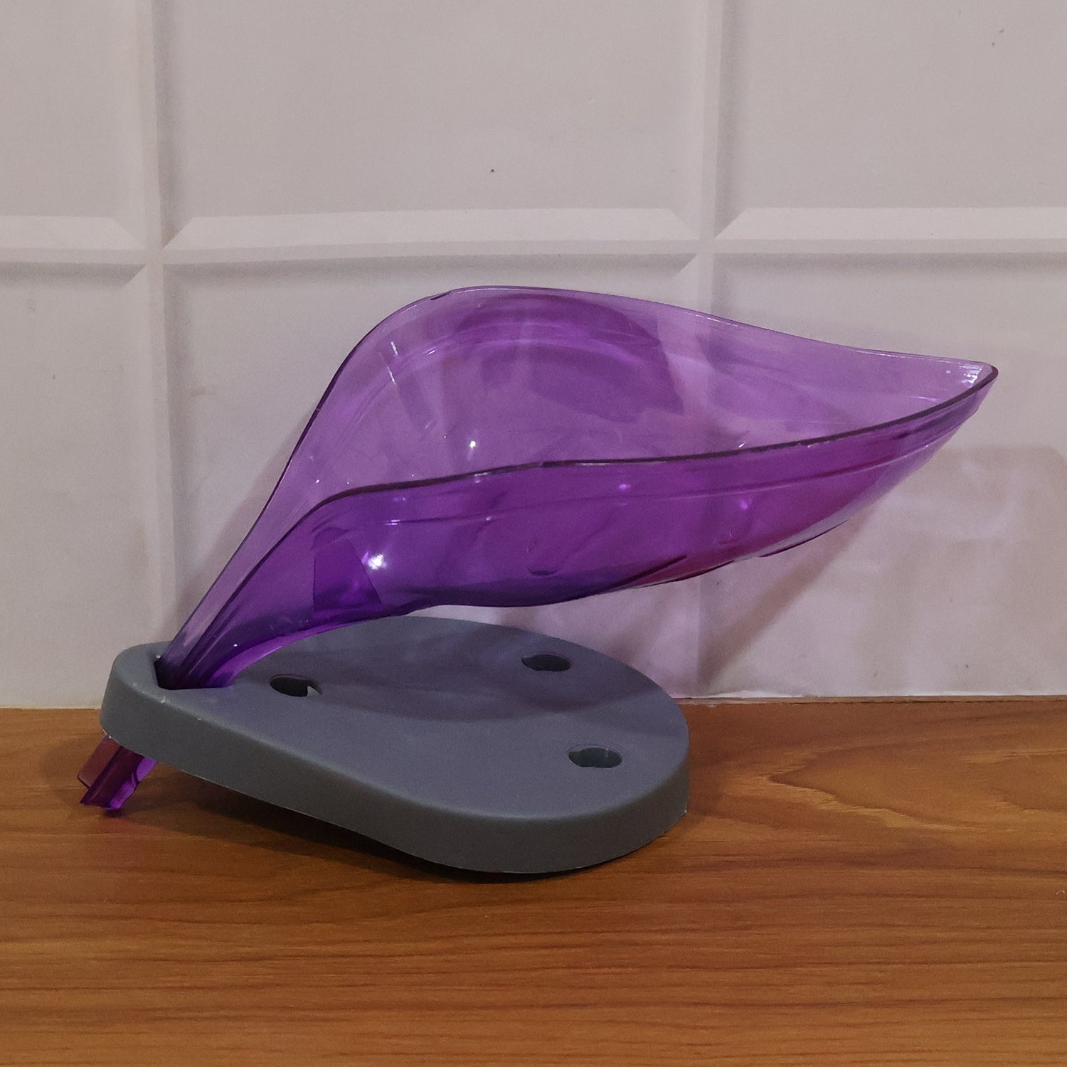 Empty leaf-shaped soap tray ready for use in a bathroom.