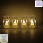 Set of 4 LED flameless lantern style decorative candles creating warm glow