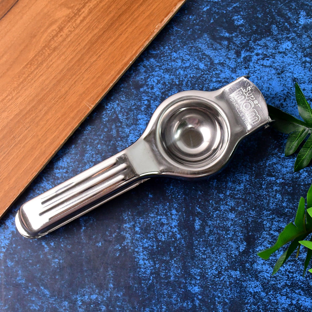 Manual steel lemon juicer showing ergonomic handles for comfortable grip