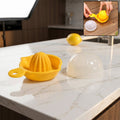 Lemon half on top of citrus juicer for demonstration