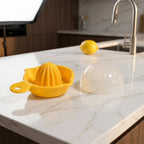 Juicer with dome lid closed, placed on kitchen countertop