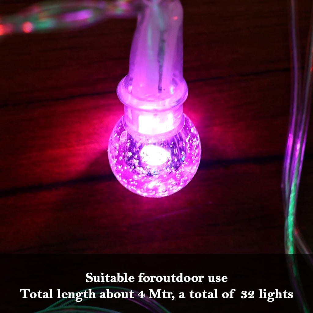 Close-up of twinkling LED bubble ball decorative string lights illuminating space
