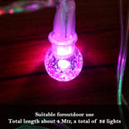 Close-up of twinkling LED bubble ball decorative string lights illuminating space