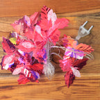 Decorative LED leaf string lights with bright multicolor LEDs glowing warmly
