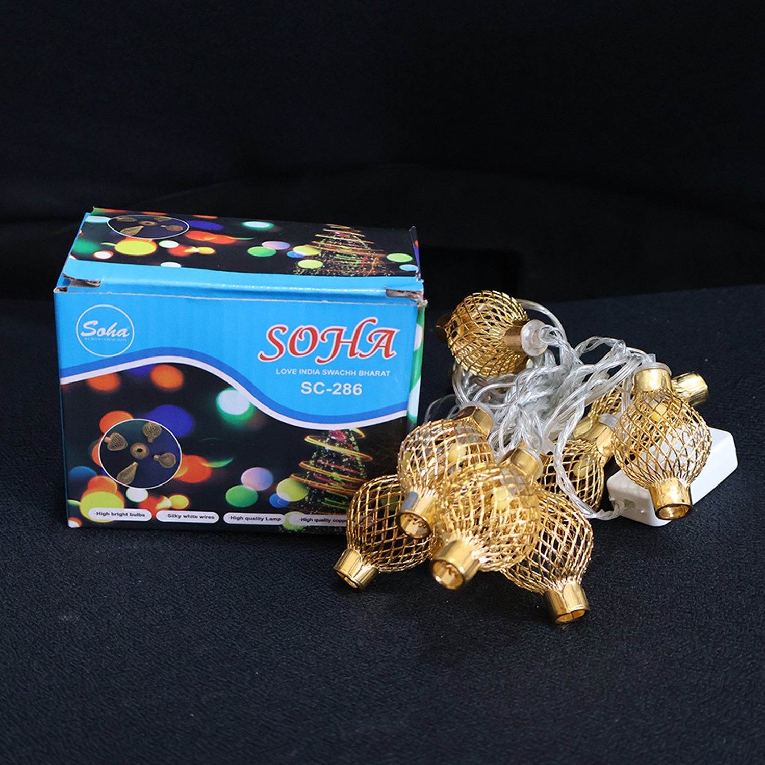 Festive decorative metal ball LED string light illuminating event backdrop