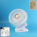 Portable mini fan with clip stand showing cooling blades