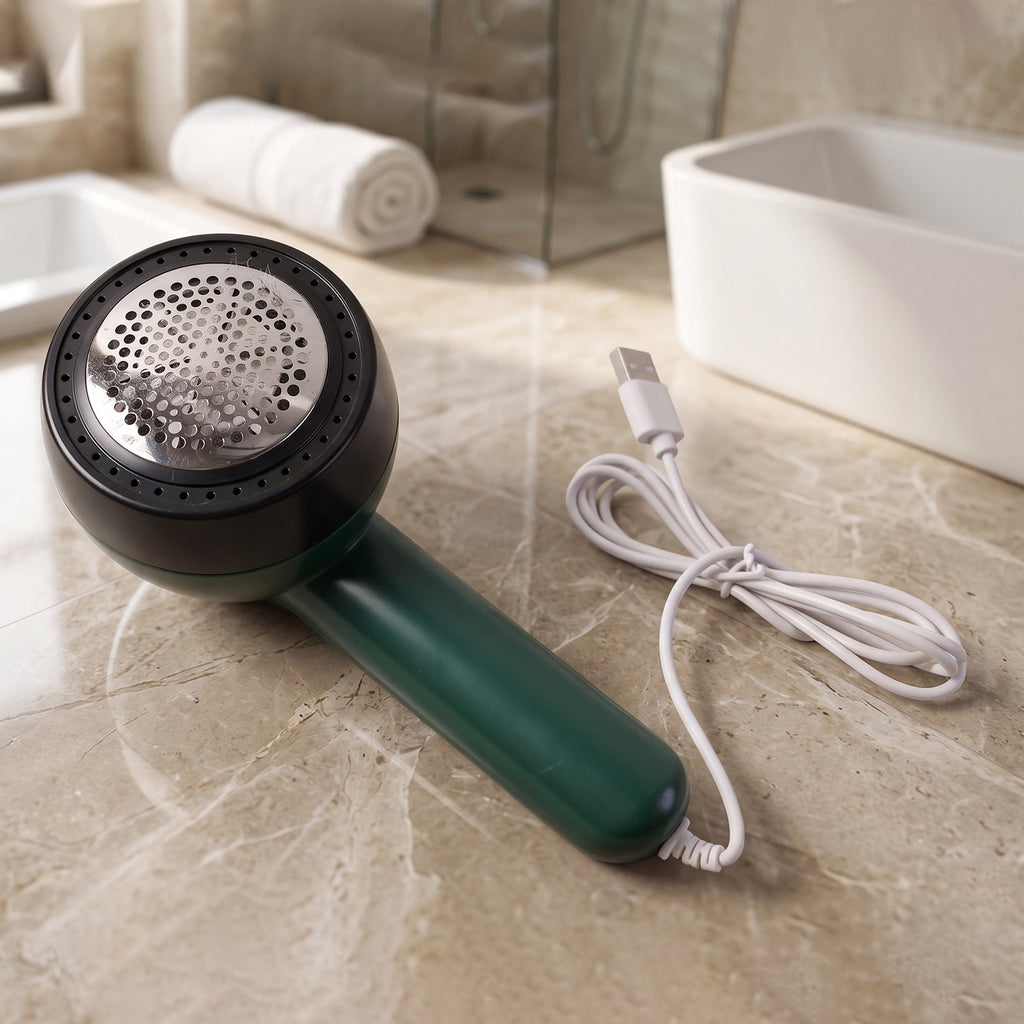 Detail view of electric lint remover device