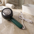 Detail view of electric lint remover device