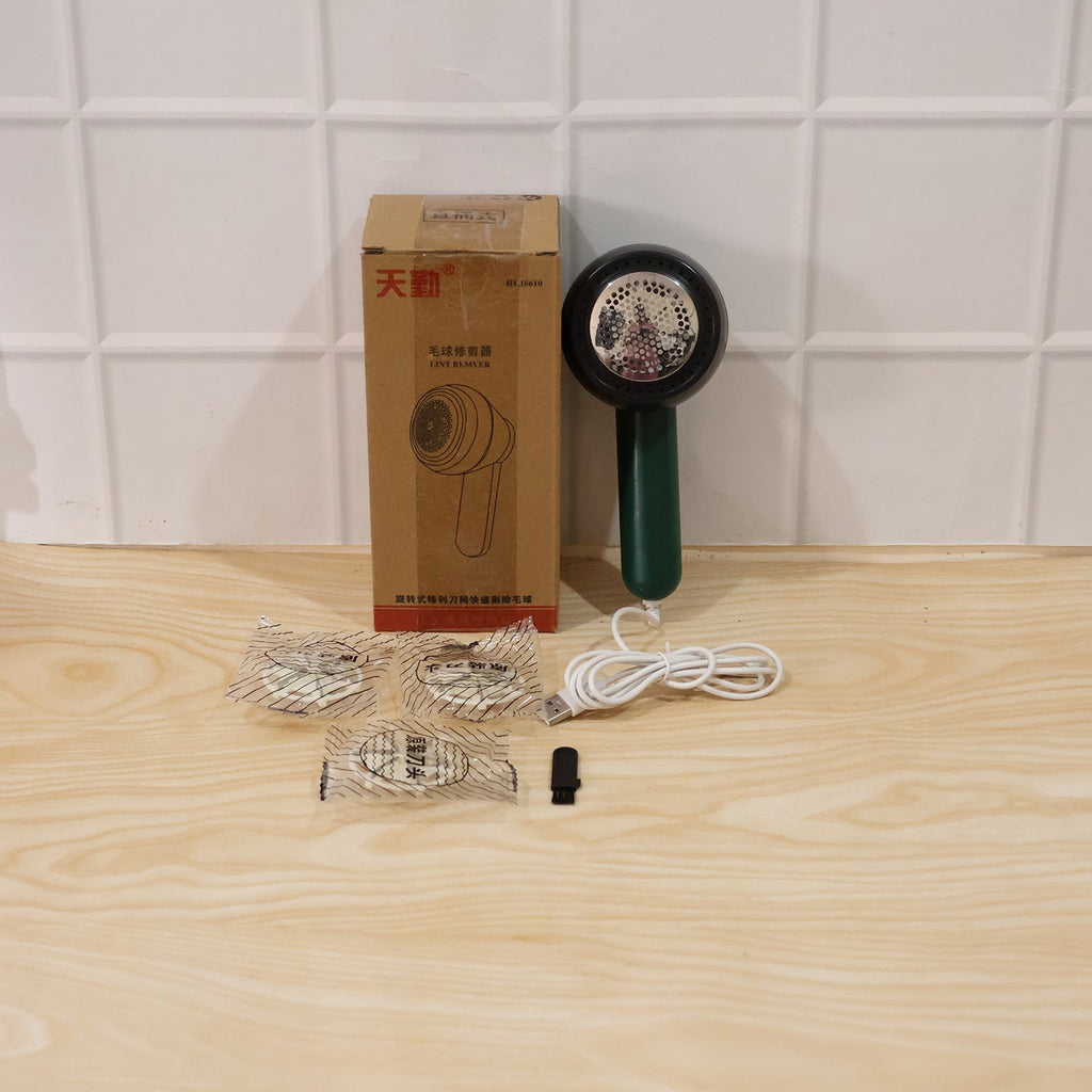 Live demonstration of electric lint remover in use