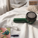 Rechargeable lint remover with protective shaving head for safe fabric fuzz removal