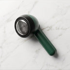 Compact lint remover for fabric grooming and wardrobe care