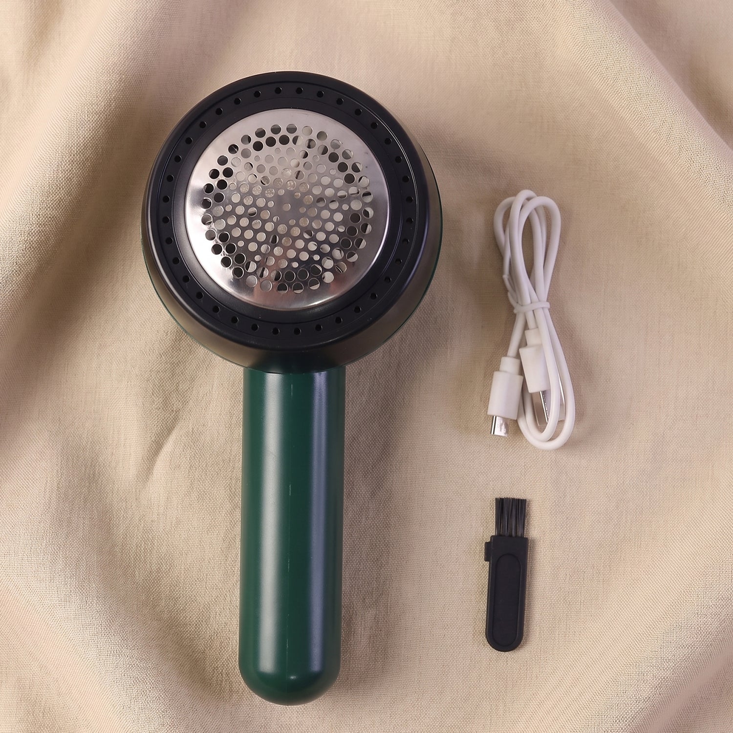 Portable lint remover in action, suited for fabric and clothes care