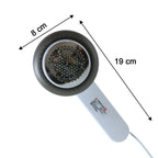 Compact rechargeable fabric lint remover showing size comparison