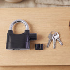Rear view of the alarm padlock, detailing the battery compartment cover.