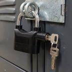 Safora Security Alarm Padlock securing a sturdy metal gate, demonstrating its anti-theft use.