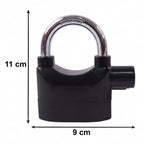 Hand holding the Security Alarm Padlock, showing its size and ergonomic grip.