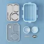 Open stainless steel lunch box showing three compartments and the bonus side container
