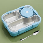 Stainless steel lunch box displayed with other meal prep items for size comparison