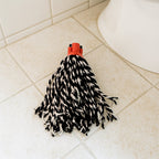 The Cotton Mop Refill head and plastic handle grip, ready for floor cleaning.