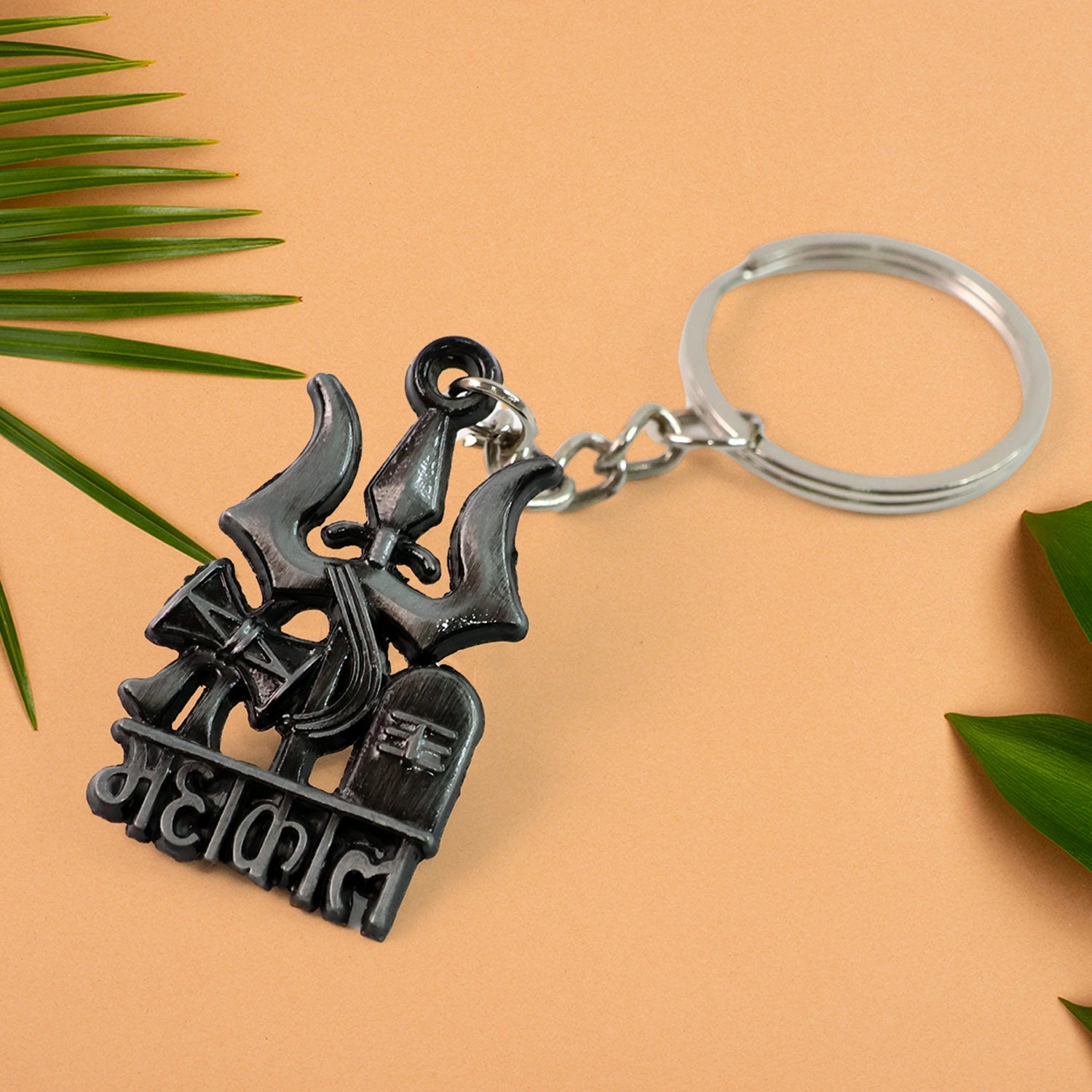 Detailed view of Mahakal Trishul keychain's sturdy metal construction