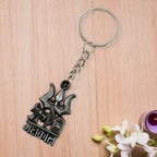 Close-up of Mahakal blessing engraved on the metal keychain