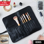 Open compact makeup brush organizer pouch showing multiple brush slots for neat storage