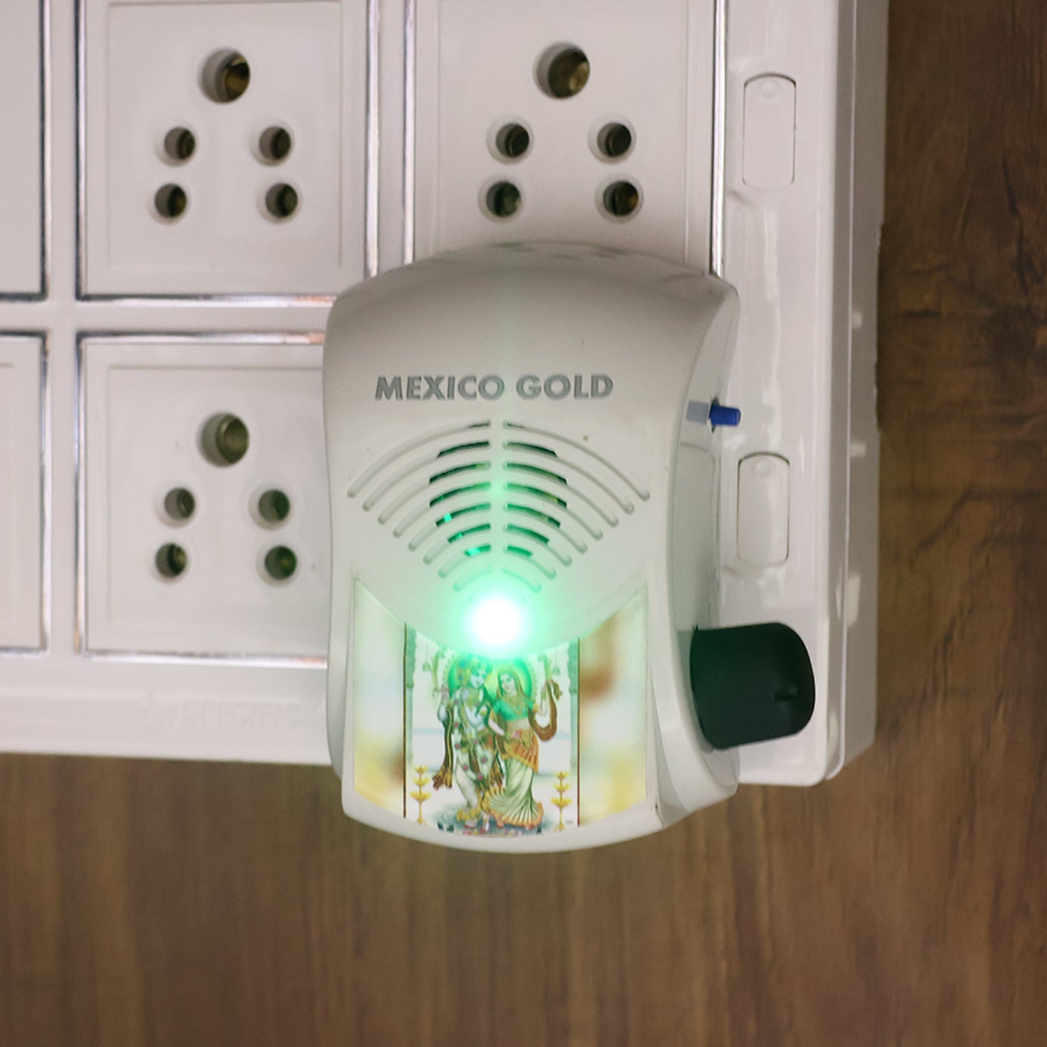 Angled view of compact electric mantra bell with glowing LED light