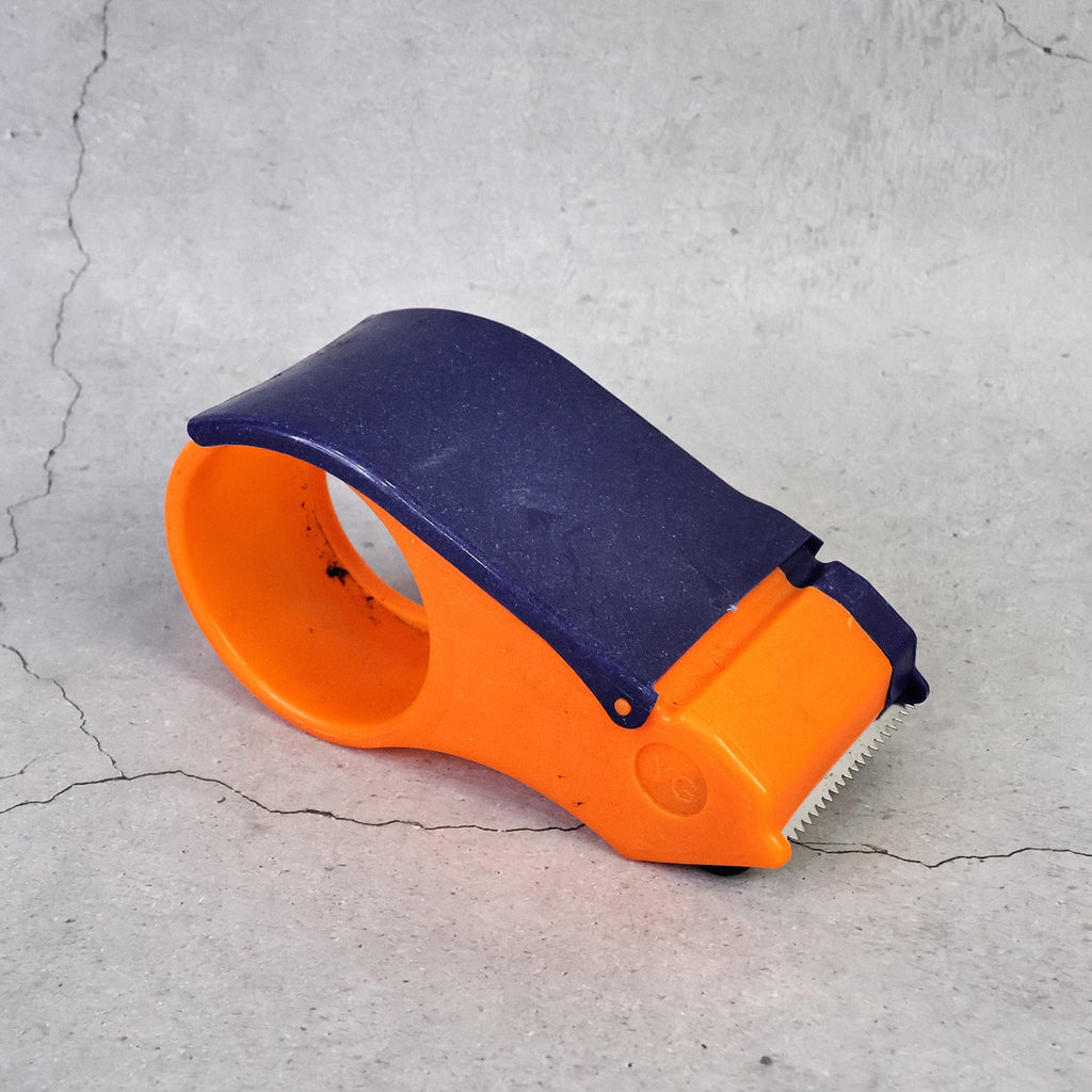 Bottom view of the 60mm hand tape dispenser, showing its robust build for office supply needs.