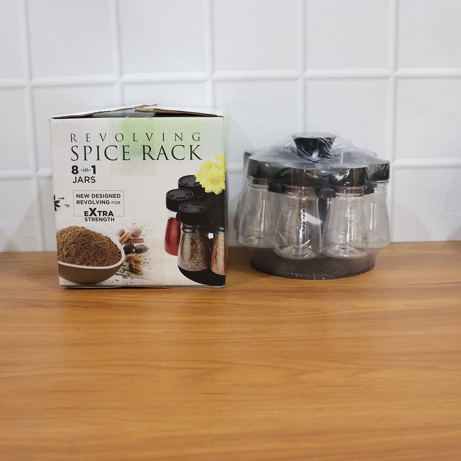 Space-saving revolving spice holder featuring transparent jars for easy identification