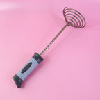 Compact vegetable and potato masher with spring mechanism and ergonomic grip