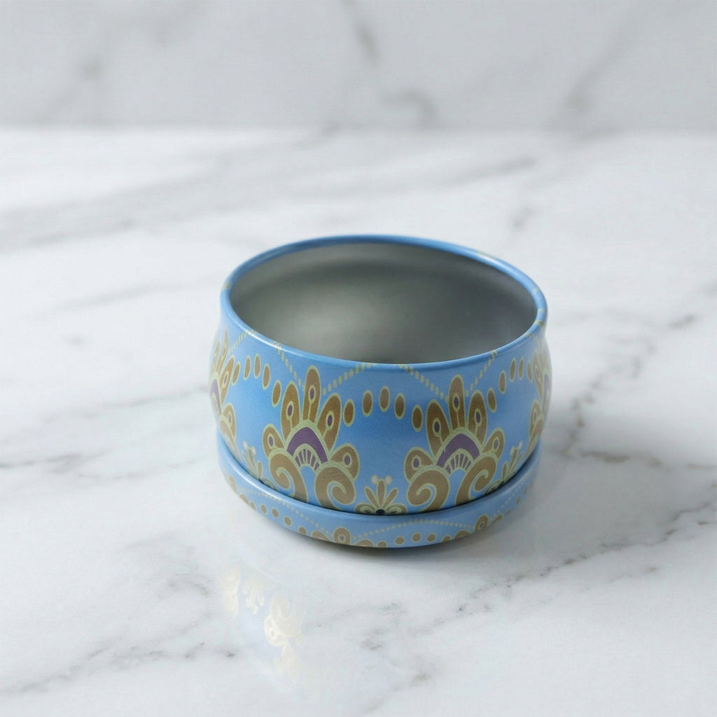 Side view of mandala metal candle container