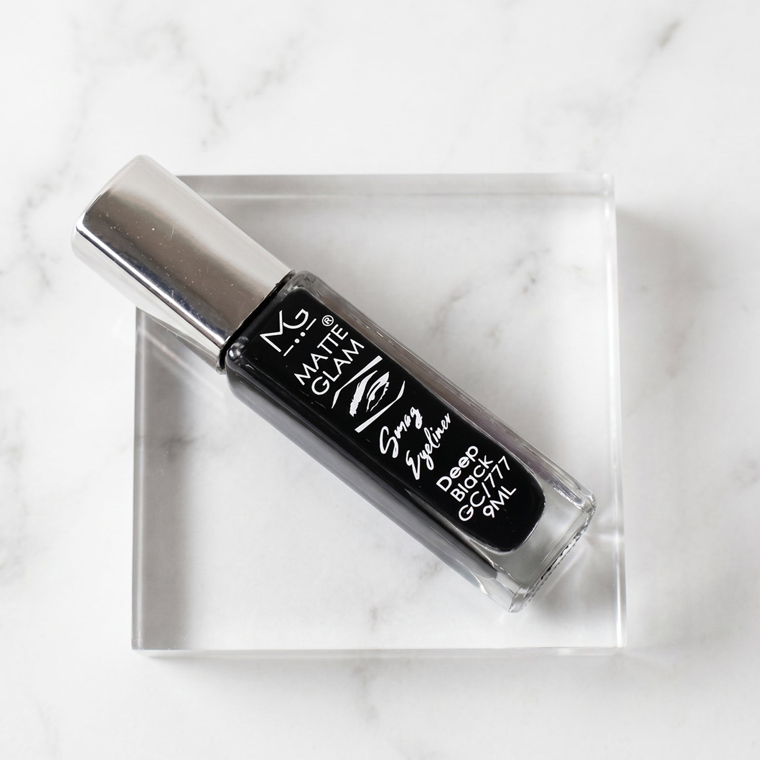 Precision applicator brush of deep black matte eyeliner for fine or bold strokes