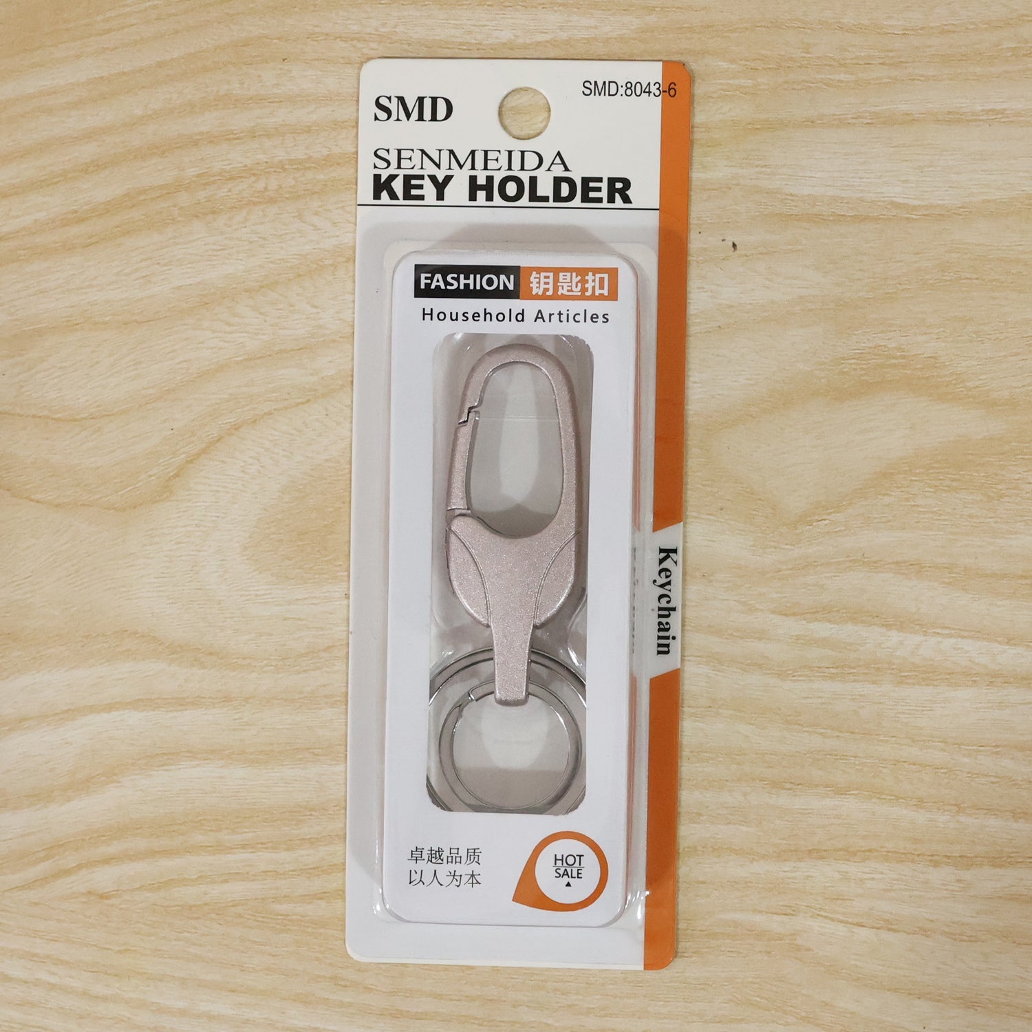 Metal keychain displayed with size reference