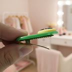 Four decorative hair clips neatly arranged with text accent styling