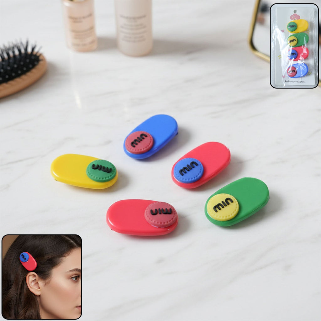 Set of 4 decorative hair clips featuring stylish text accents