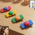 Set of four colorful candy hair clips with vibrant snap design on white background